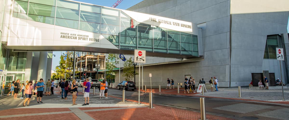 National World War II Museum which includes a city, street scenes and a bridge