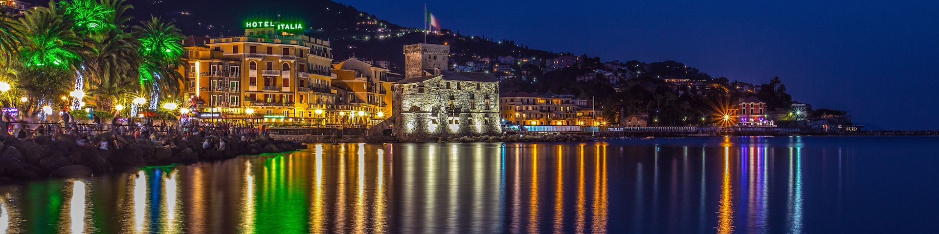 RAPALLO, ITALY JULY, 1, 2015 - View of Rapallo, Genoa (Genova) province and the castle on the sea by night.