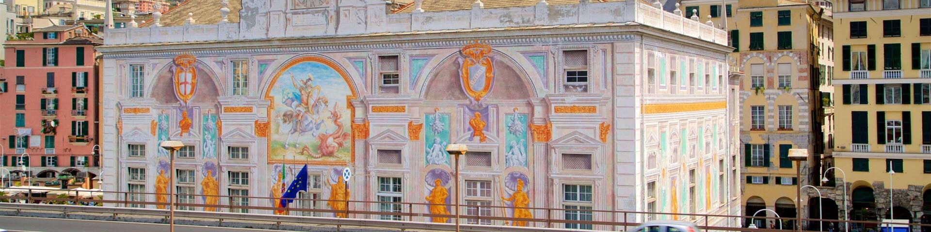 A historic building with ornate murals and a clock tower.