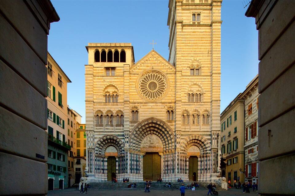A historic church with a tall bell tower and intricate facade.