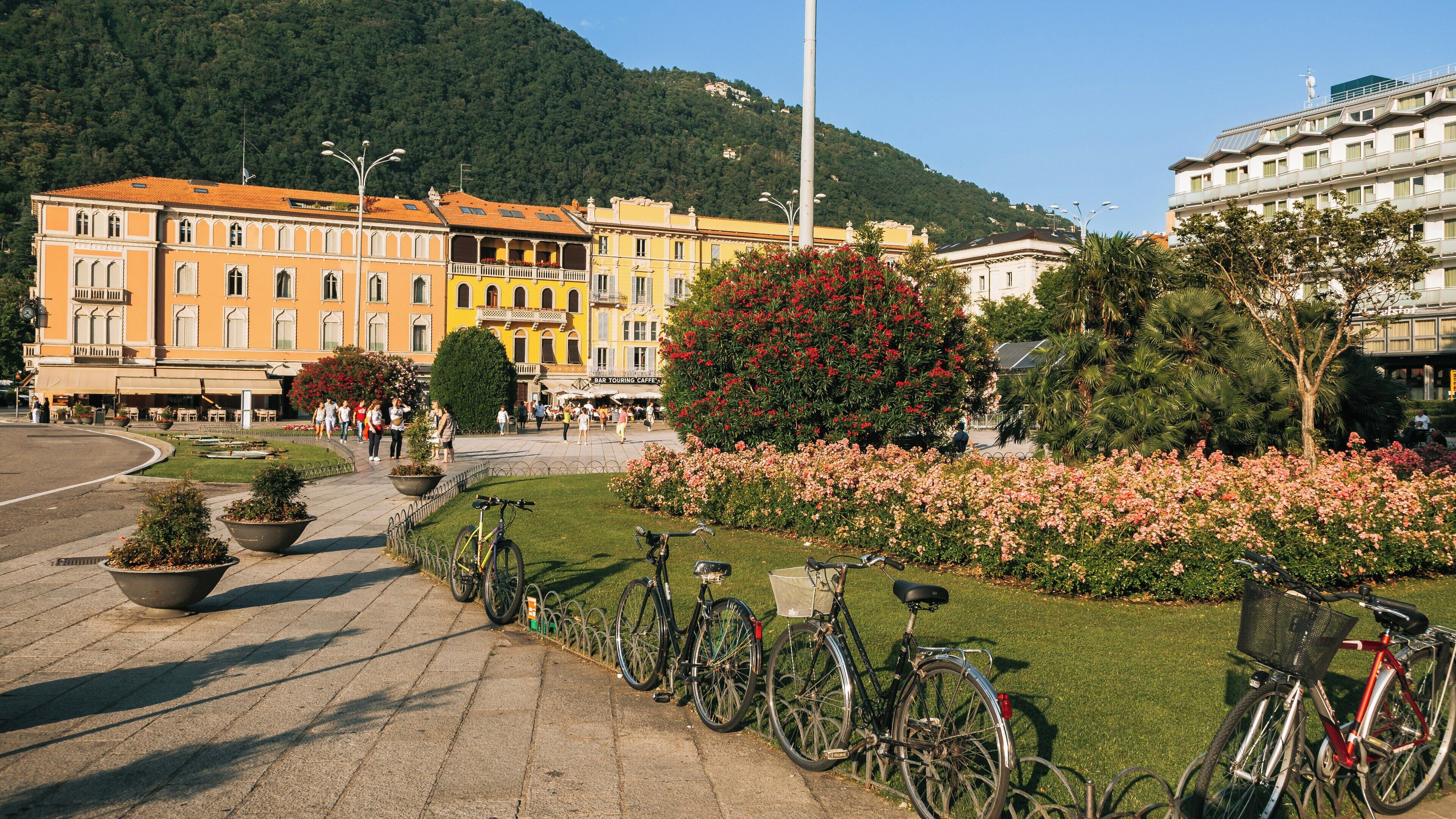Vibrant Piazza Cavour in Como City Centre showcases bustling activity and scenic beauty in Lombardy, Italy during a sunny day