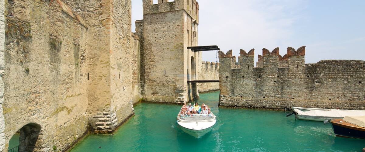 Scaliger Castle showing château or palace, boating and vehicle touring