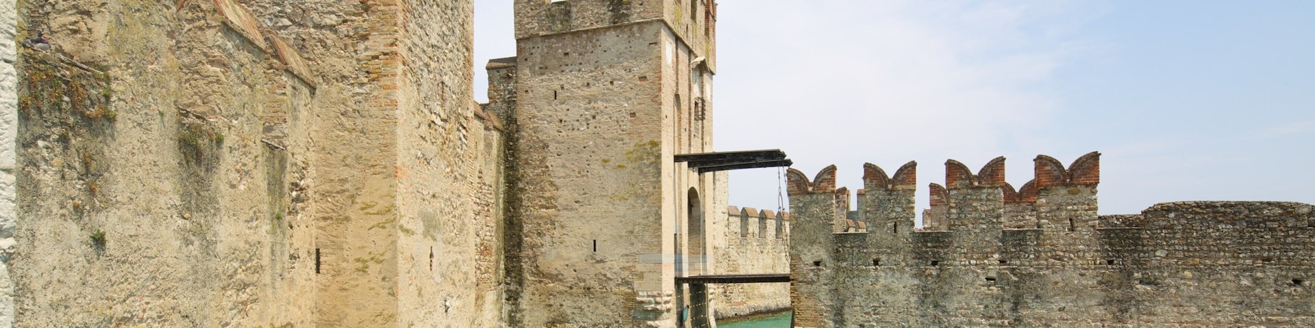 Scaliger Castle featuring vehicle touring, boating and chateau or palace