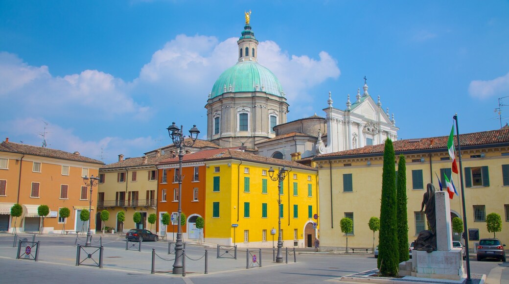 Cathedral of San Giovanni Battista showing a square or plaza, a city and a church or cathedral