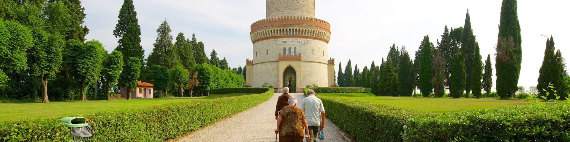 Tower of St. Martin which includes a garden and a monument as well as a small group of people