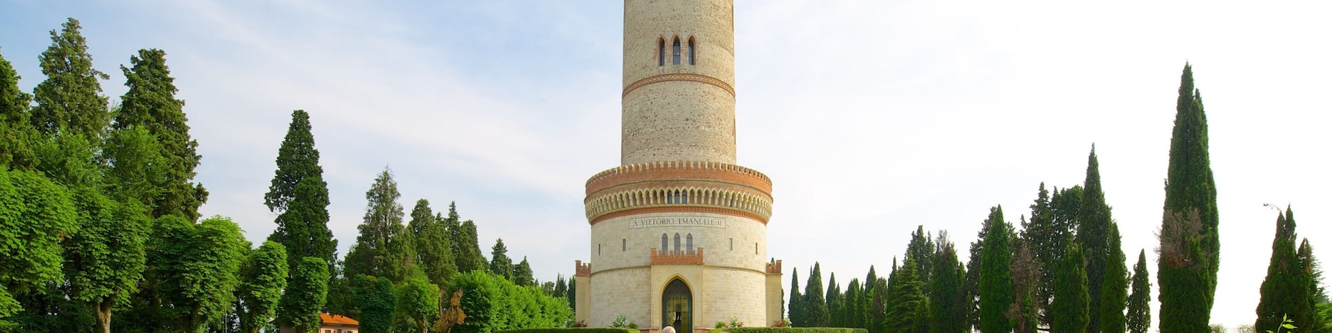 Tower of St. Martin which includes a garden and a monument as well as a small group of people