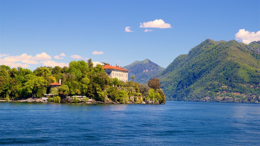 Jardín Botánico de Isola Madre mostrando montañas, una pequeña ciudad o aldea y un lago o espejo de agua