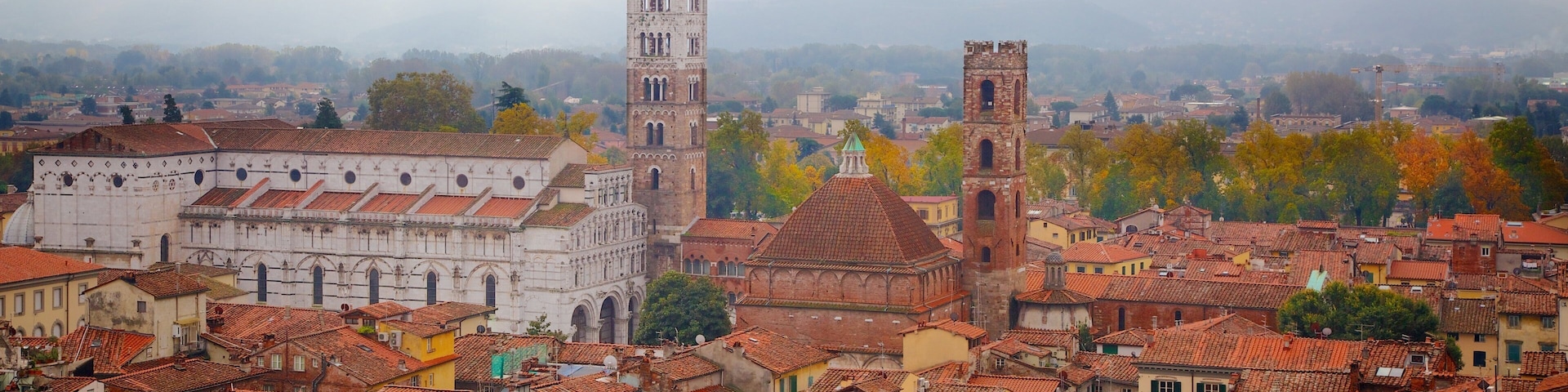 Torre delle Ore featuring heritage architecture and a city