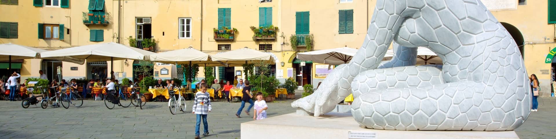 Piazza dell\'Anfiteatro which includes outdoor art, a square or plaza and a statue or sculpture