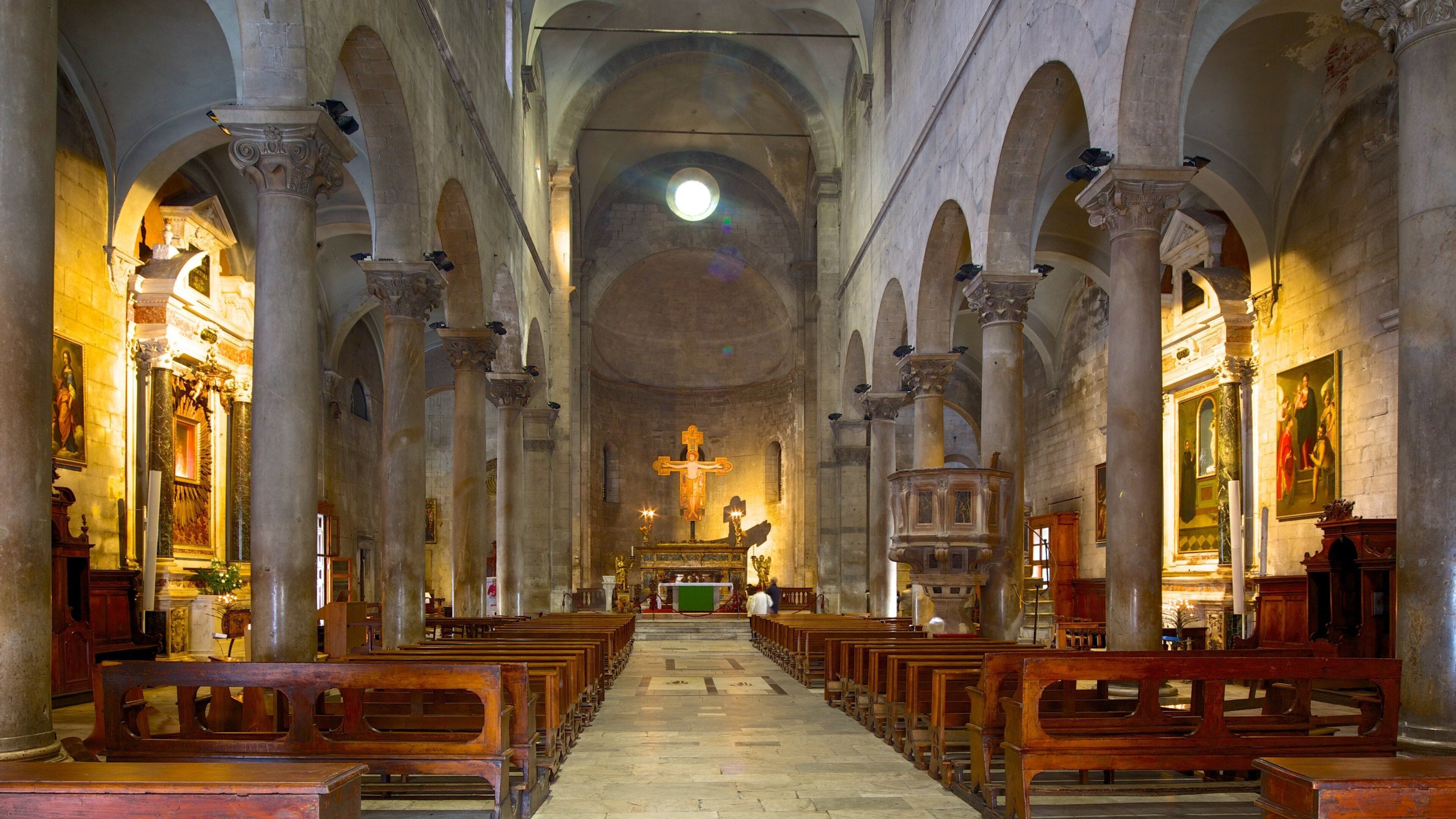 Piazza San Michele featuring heritage architecture, a church or cathedral and interior views