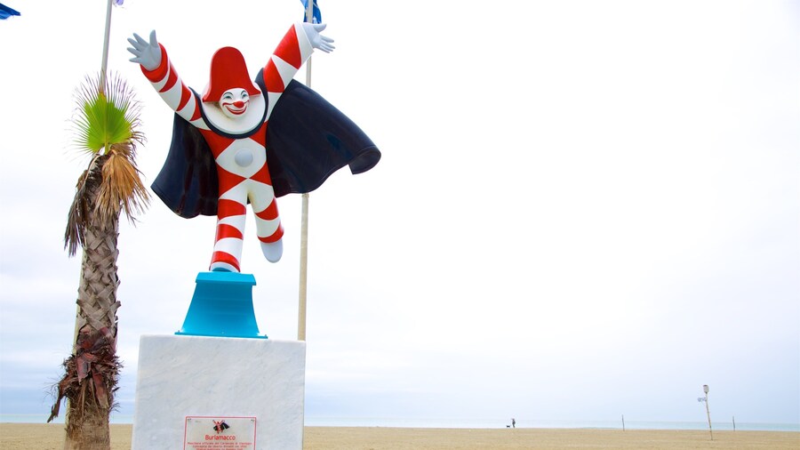 Statue of Burlamacco which includes a statue or sculpture and a sandy beach