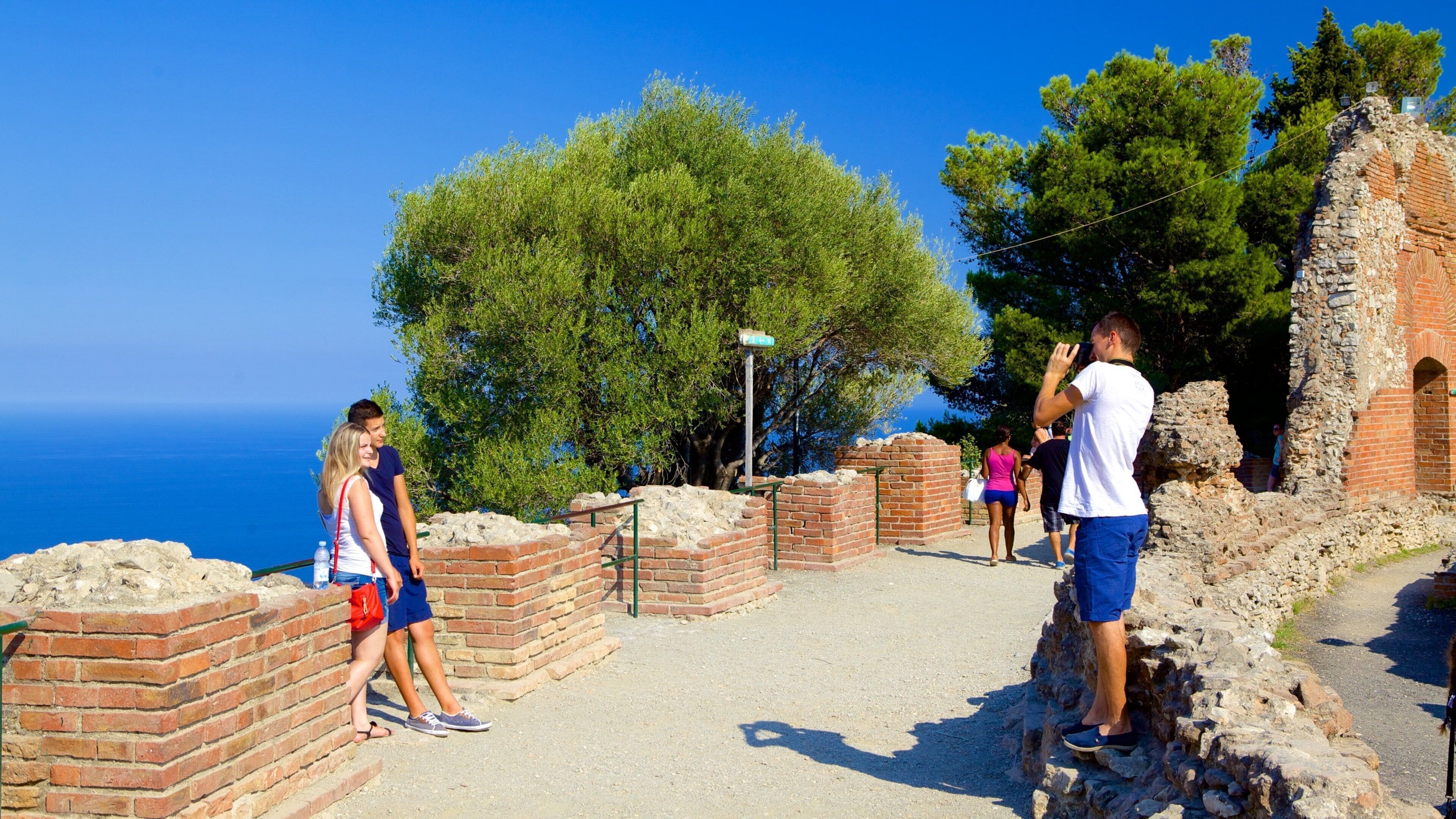 Greek Theatre which includes building ruins and general coastal views