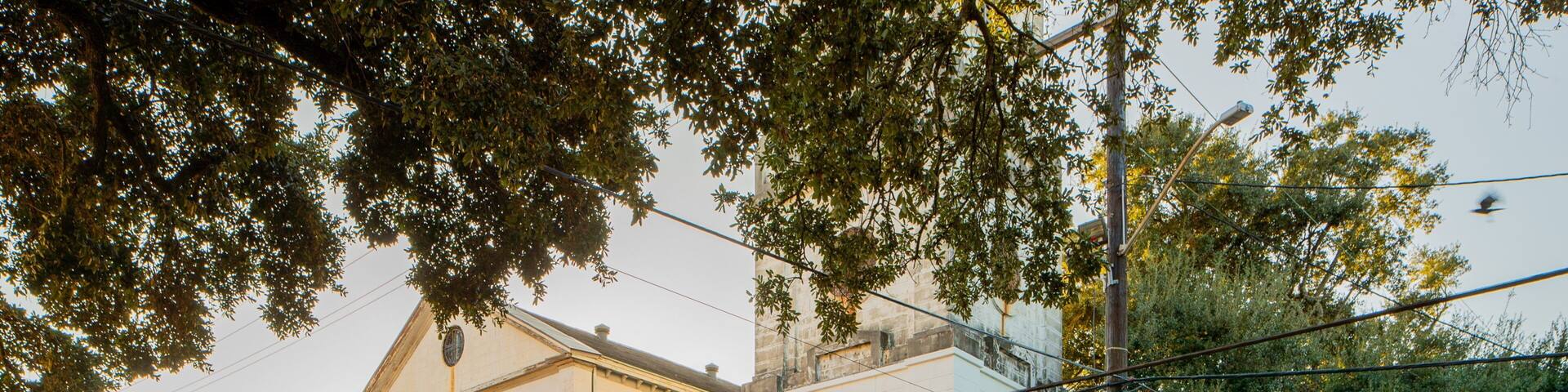 Saint Augustine Church which includes a church or cathedral and a sunset