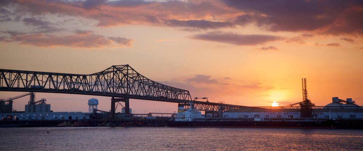 Howard Wilkinson Bridge showing a river or creek, a sunset and a bridge