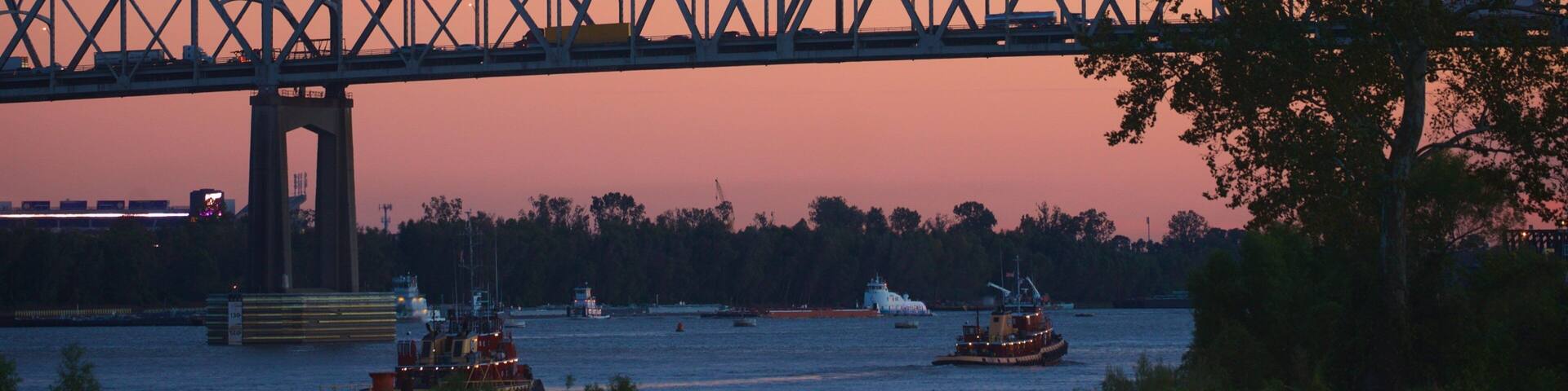 Howard Wilkinson Bridge which includes a river or creek, a bridge and a sunset