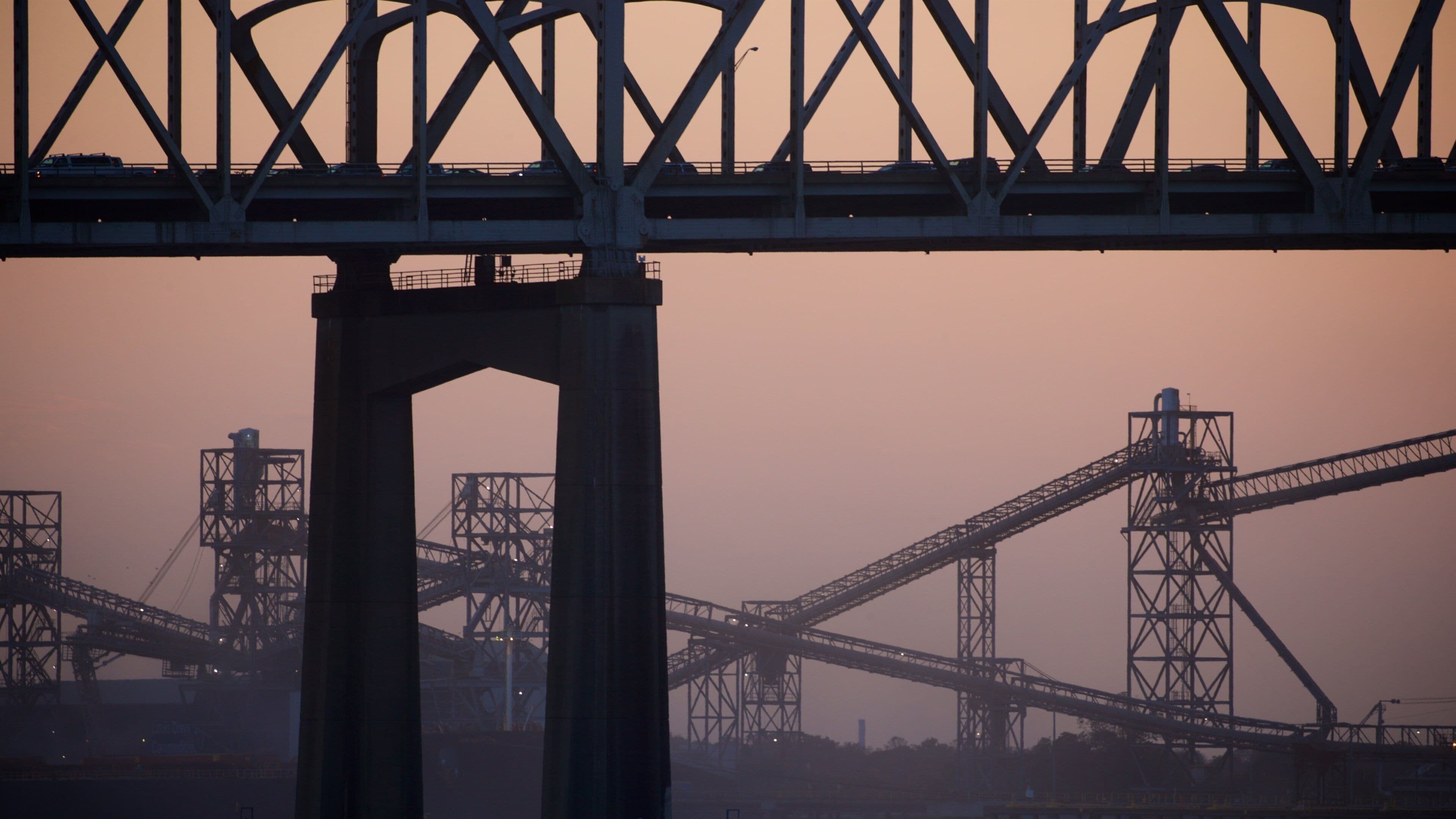 Howard Wilkinson Bridge featuring a bridge and a sunset