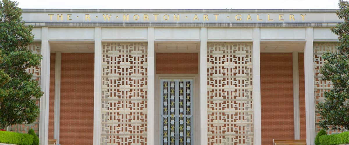 The PW Norton Art Gallery with a central entrance flanked by decorative screens and brick columns.