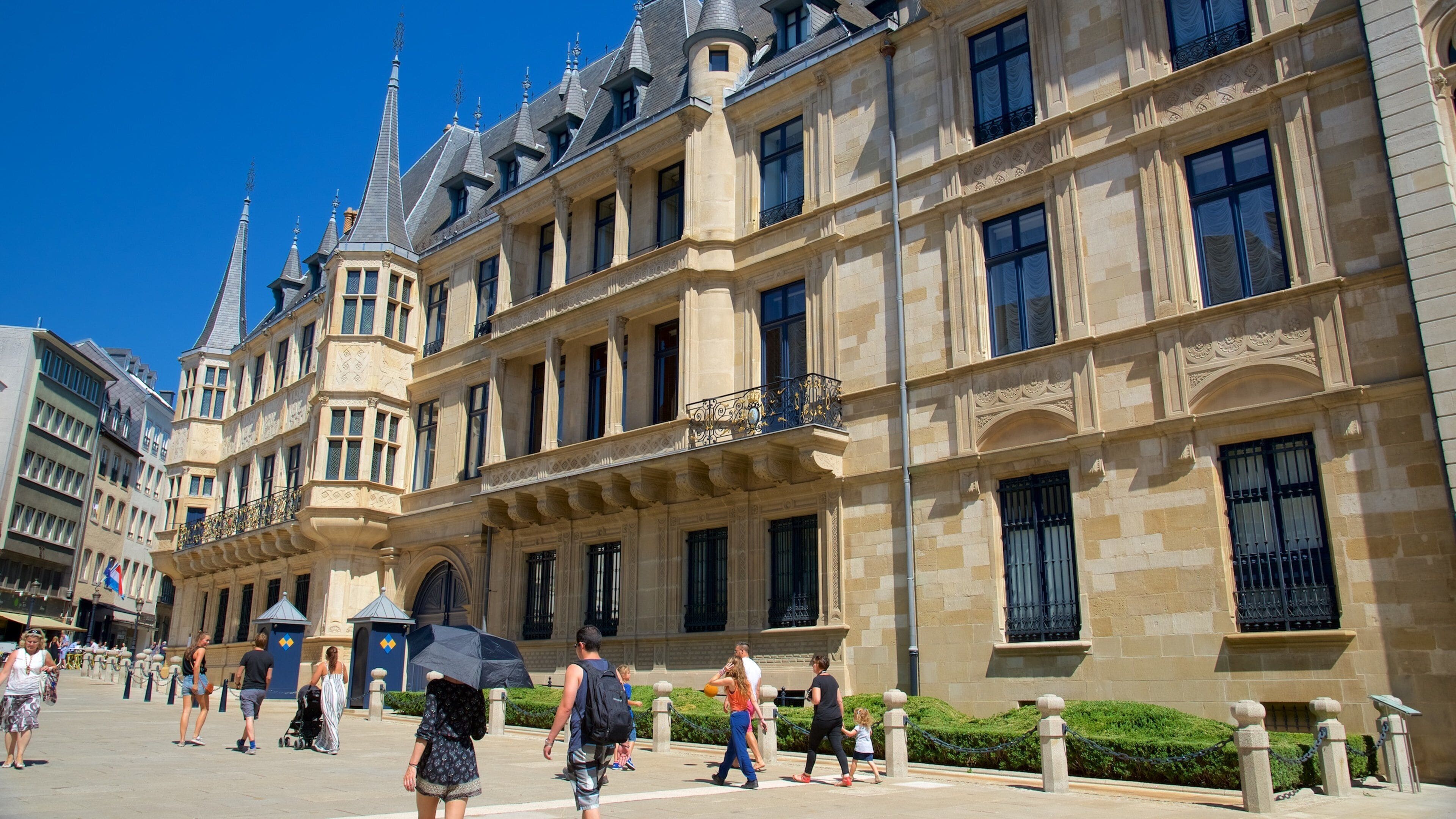 A historic building with ornate architecture and a clear blue sky.