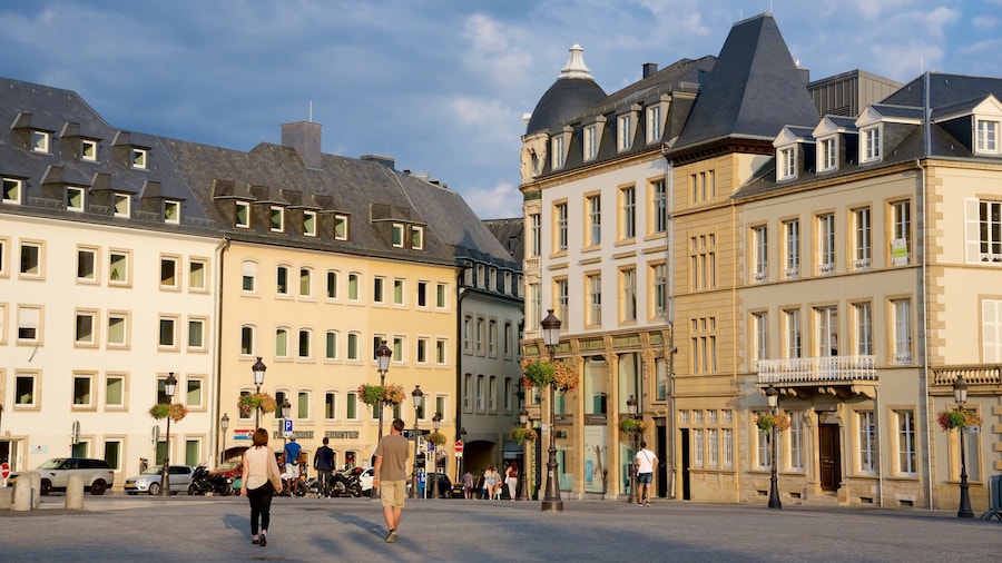 Luxembourg featuring a square or plaza and heritage architecture as well as a small group of people