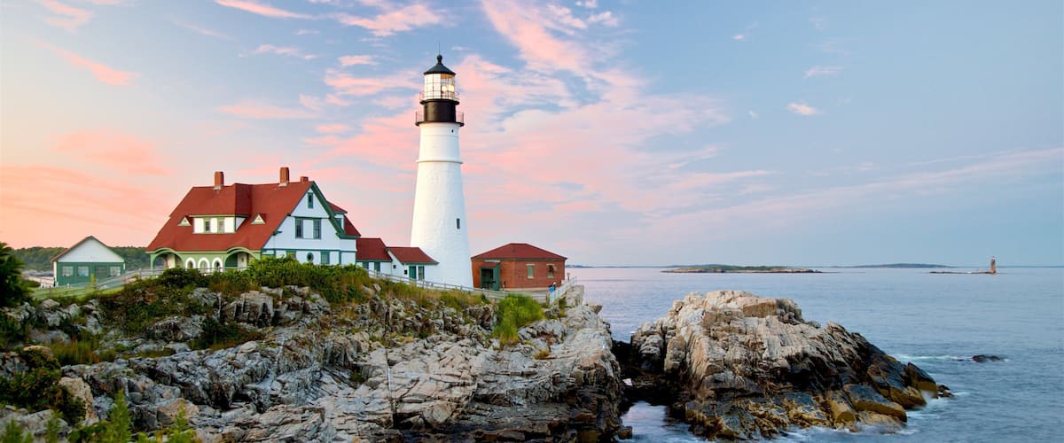 Portland Head Light featuring rocky coastline, a sunset and general coastal views