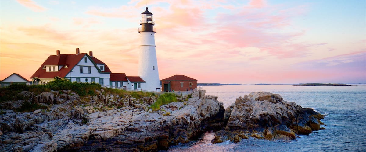 Portland Head Light showing rocky coastline, general coastal views and a sunset