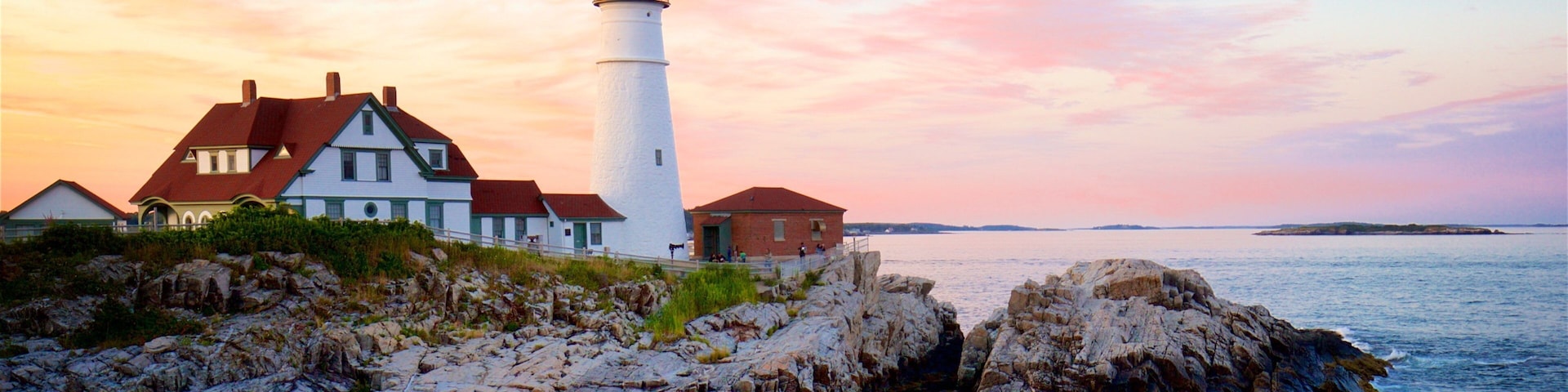 Portland Head Light showing rocky coastline, general coastal views and a sunset