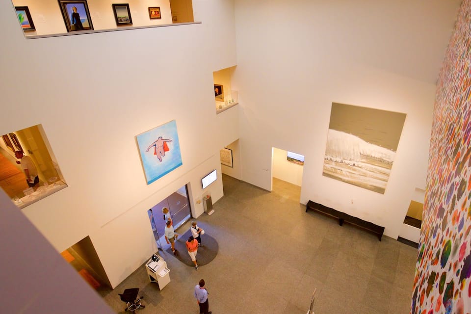 An art gallery with various paintings and sculptures.