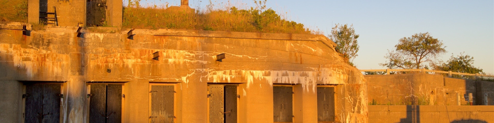 Fort Preble showing a sunset and heritage architecture