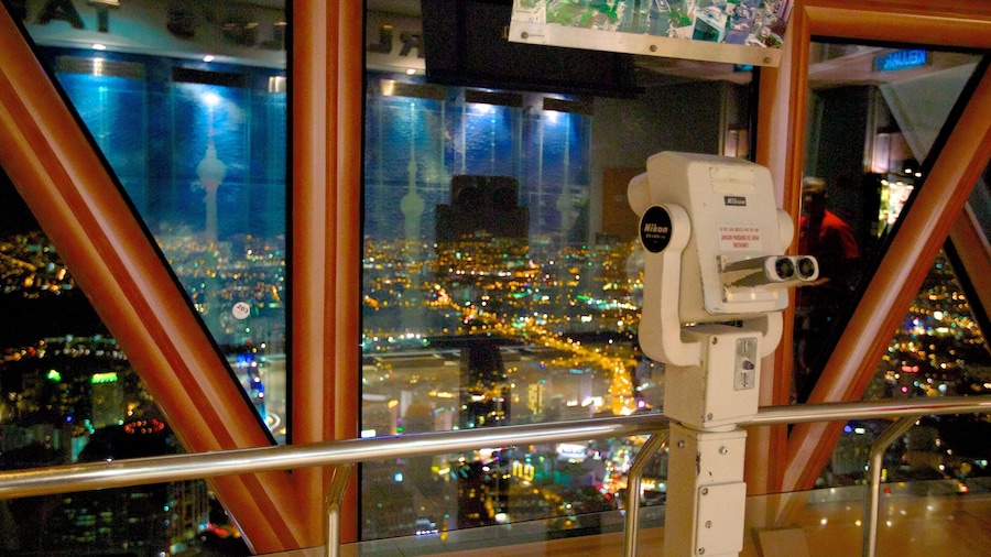 Kuala Lumpur Tower which includes a city, night scenes and views