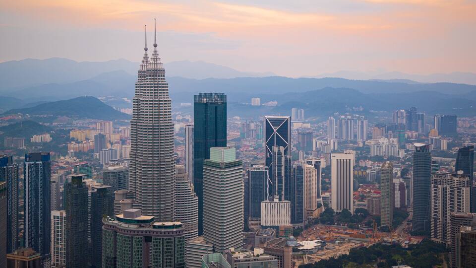 A cityscape with prominent skyscrapers, including a distinctive tower with two spires.