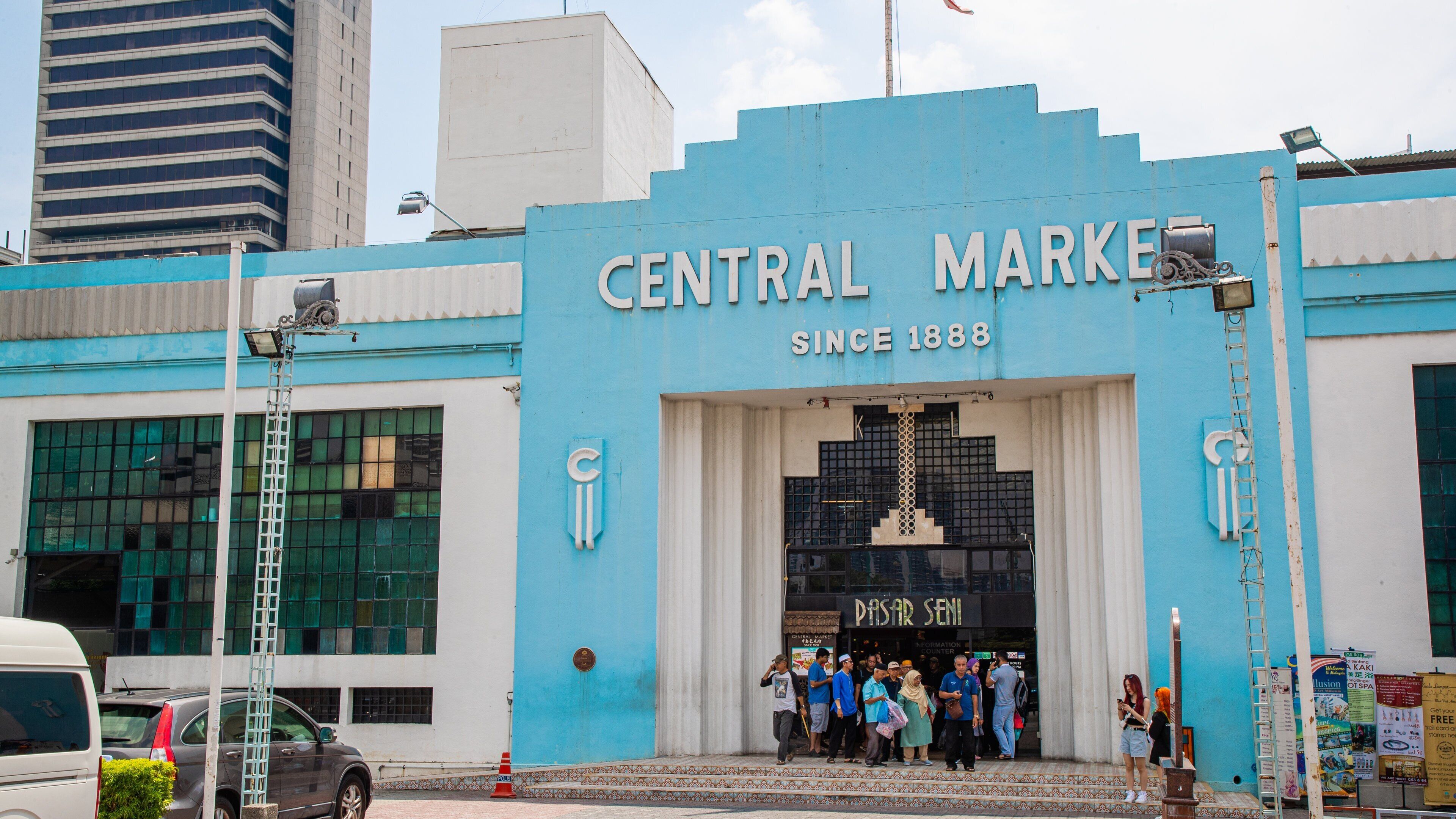 A blue building with the sign "Central Market" and "Since 1888" on it.