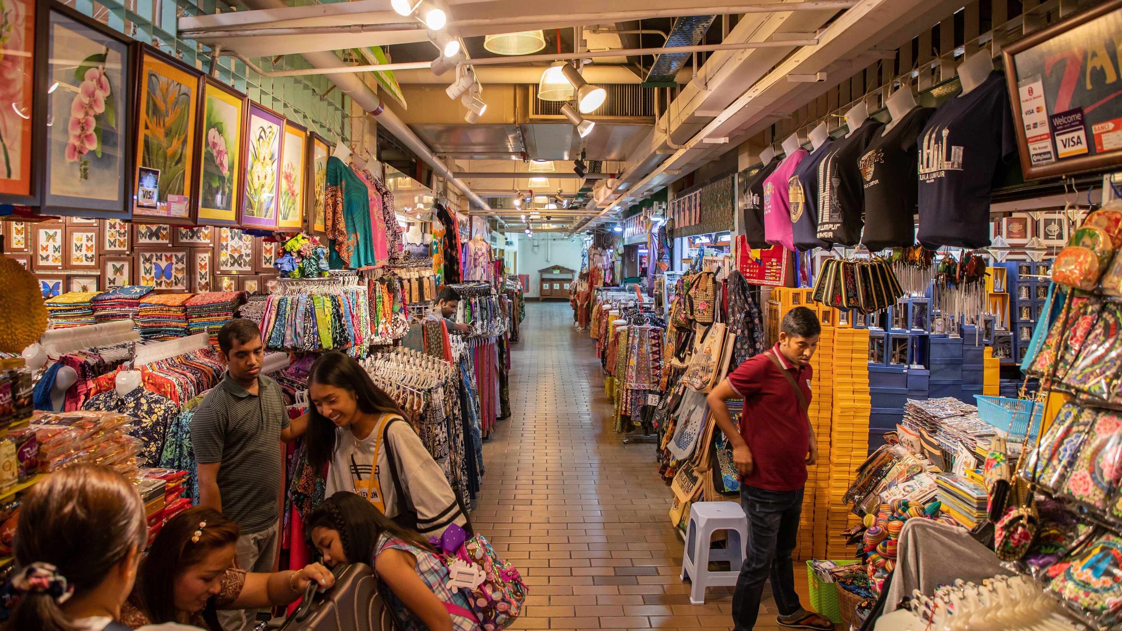 Central Market which includes shopping and interior views as well as a small group of people