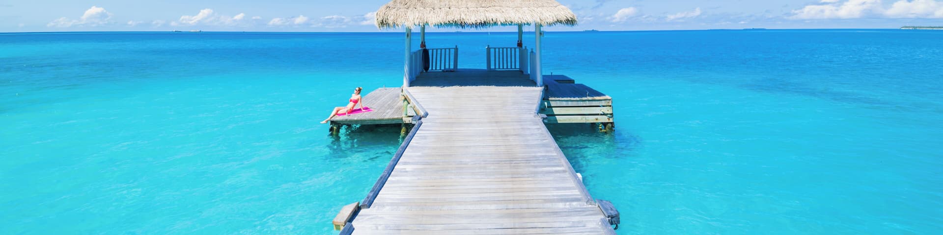 Paradise beach. Holiday vacations tourism concept. Tropical resort jetty in Maldives