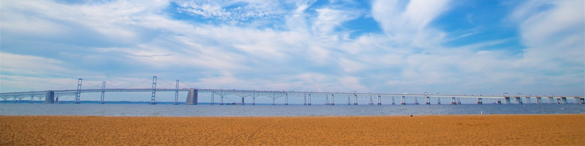 Chesapeake Bay Bridge which includes a bridge, landscape views and a sandy beach