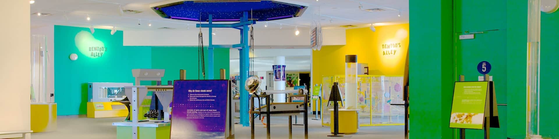 A science museum with interactive exhibits and a central display featuring a large circular platform.