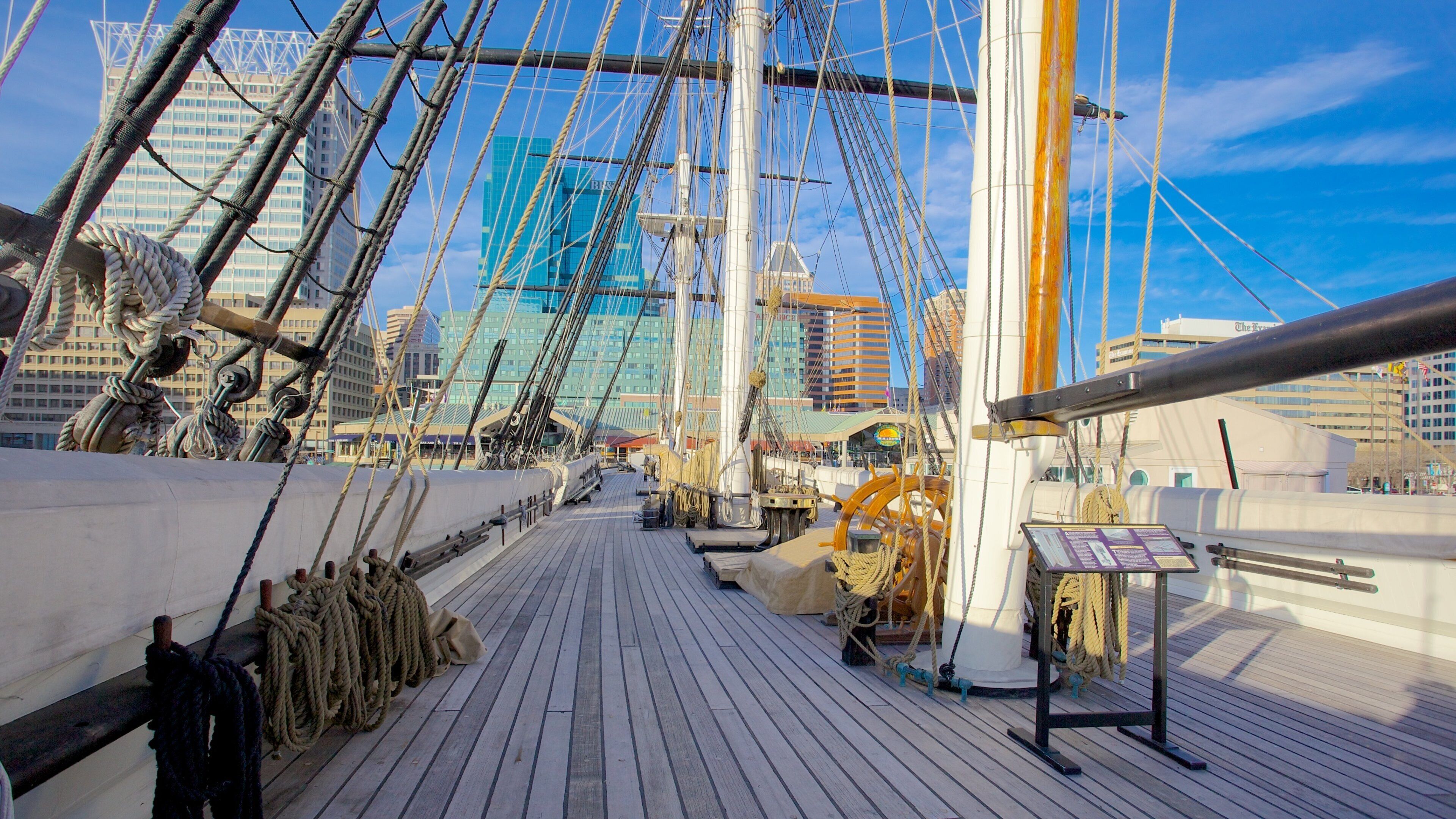 USS Constellation docked in Baltimore, Maryland, showcasing the historic ship's deck amidst modern city skyline