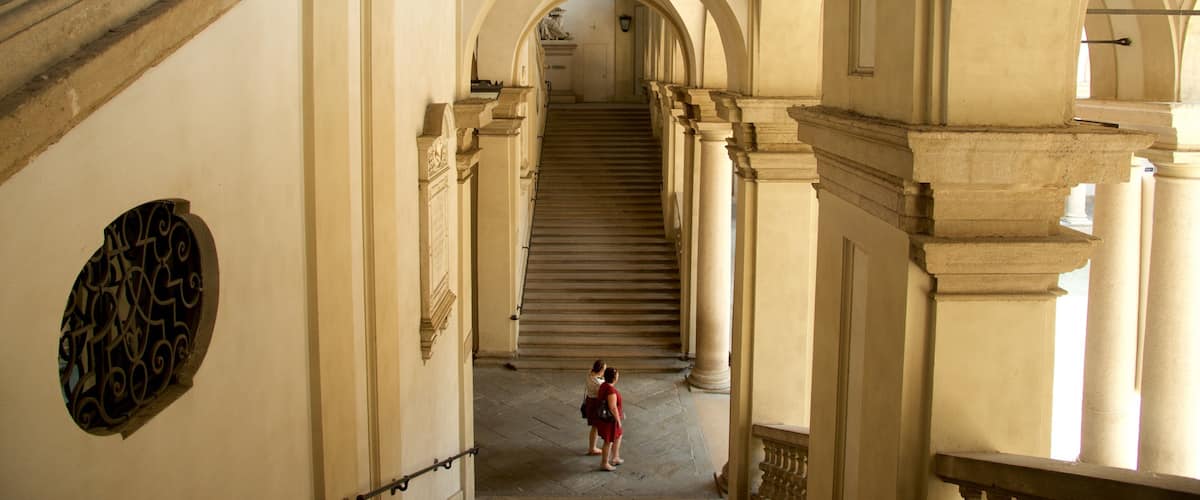 Pinacoteca di Brera featuring interior views and heritage architecture as well as a couple