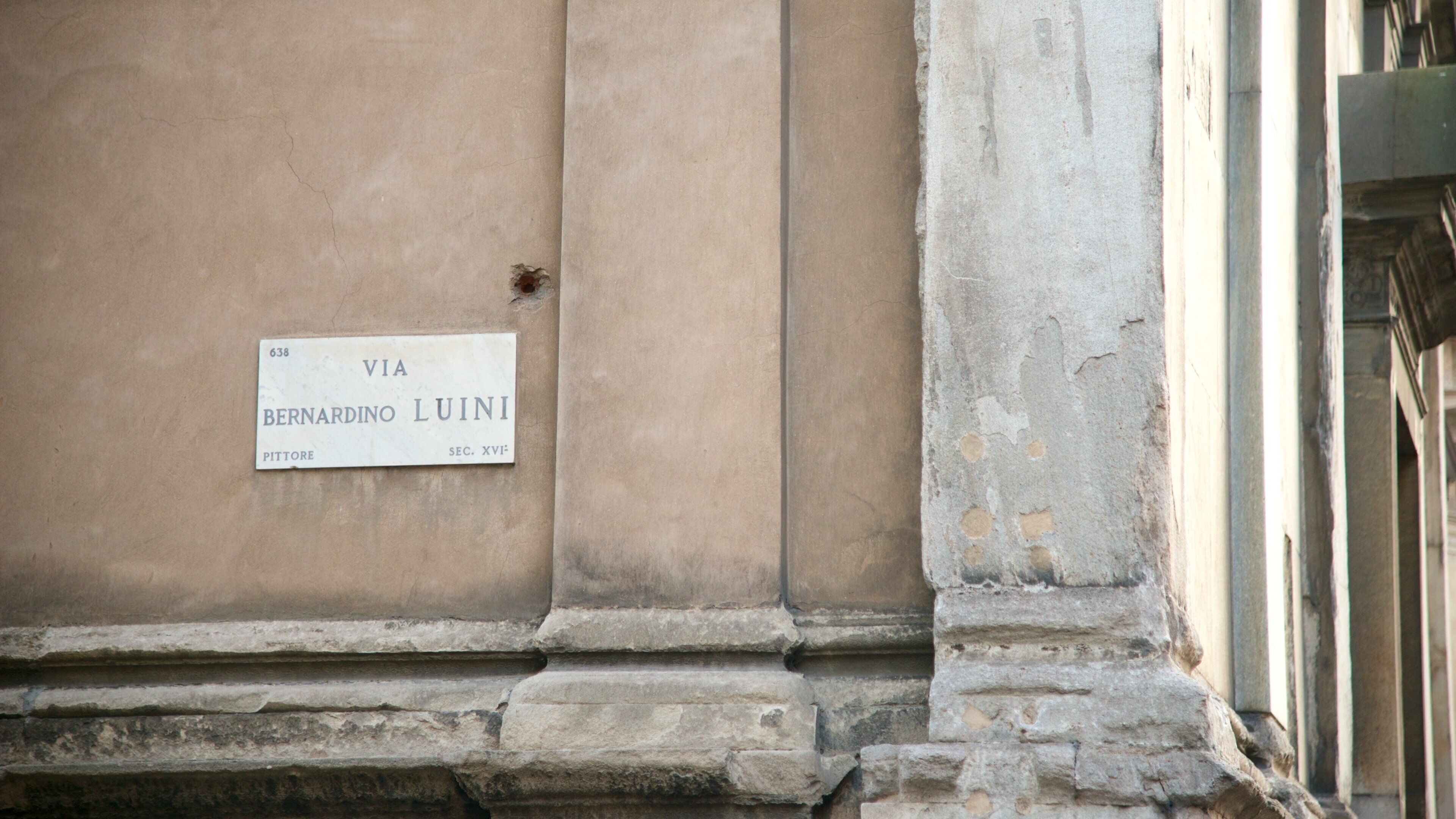 Milan featuring heritage architecture, signage and a church or cathedral