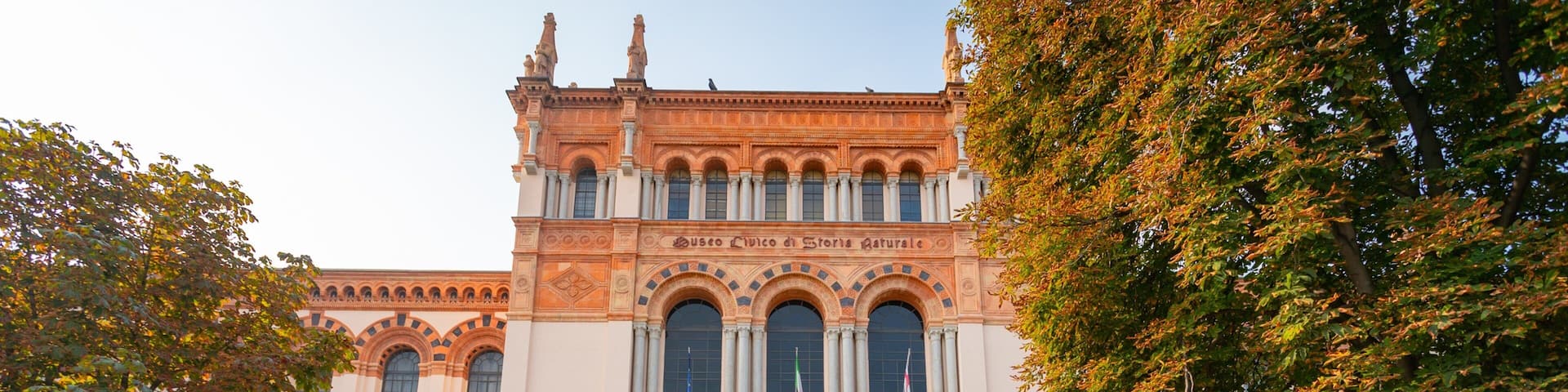 A historic building with arched windows and a central entrance.