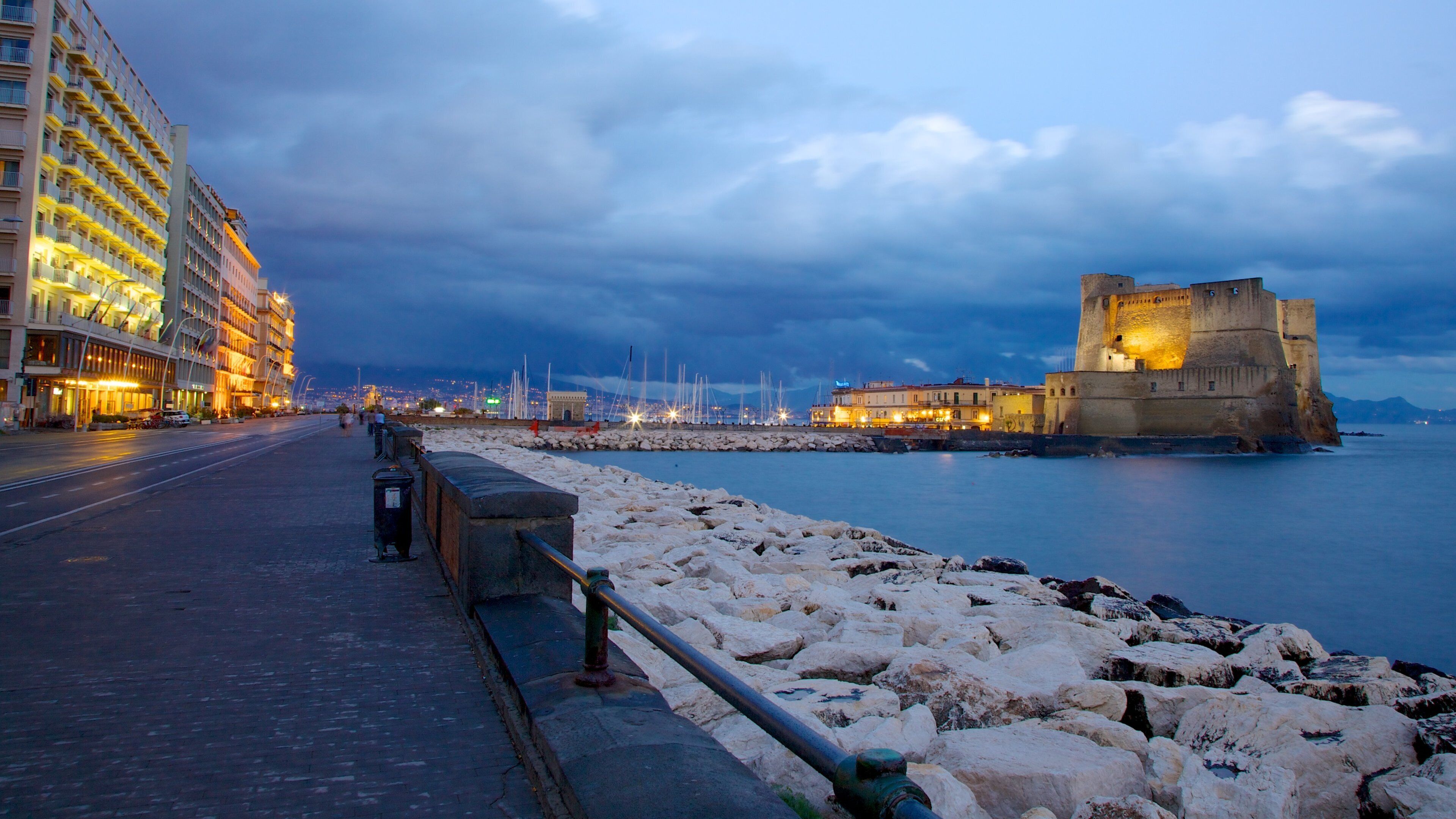 Castel dell\'Ovo featuring a castle, general coastal views and night scenes