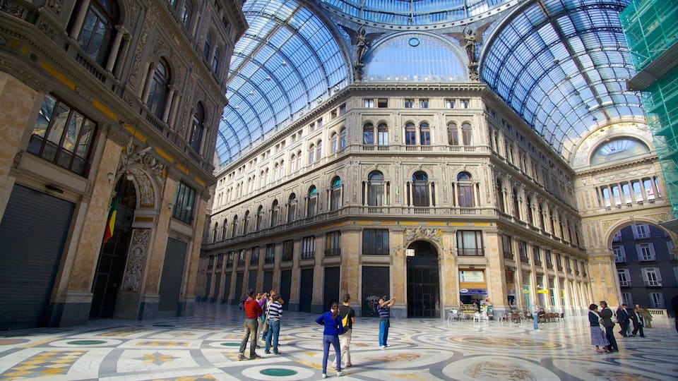 A grand building with a glass dome and ornate architecture.