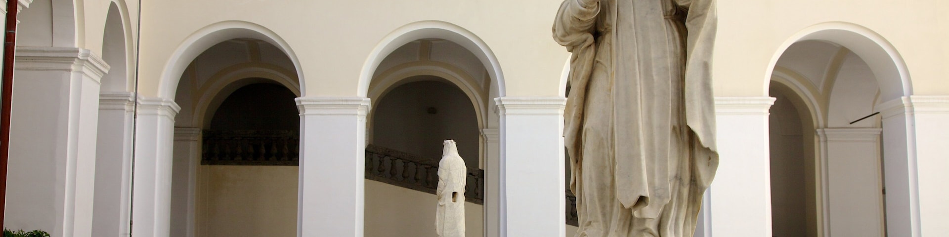 Piazza San Domenico Maggiore which includes religious aspects, a square or plaza and a statue or sculpture