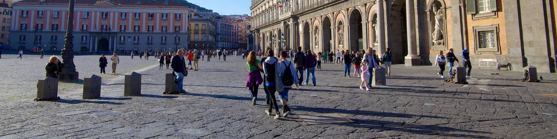 Royal Palace featuring château or palace and street scenes as well as a large group of people