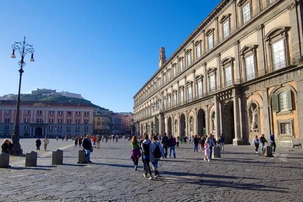 Royal Palace featuring château or palace and street scenes as well as a large group of people