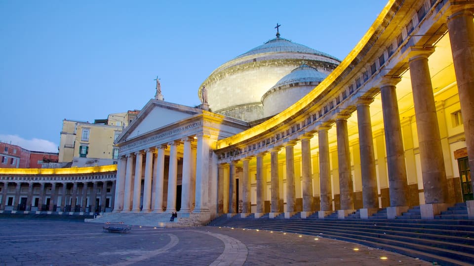 A grand neoclassical building with a large dome and columns, surrounded by a spacious courtyard.