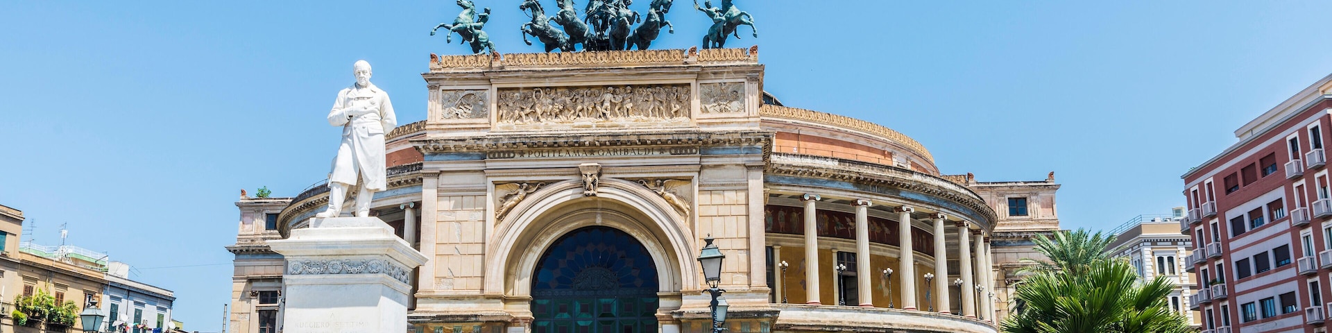 M8720P Palermo, Italy - August 10, 2017: Facade of the Politeama Garibaldi Theatre with the statue of Ruggero Settimo in the center of Palermo in Sicily, Ita