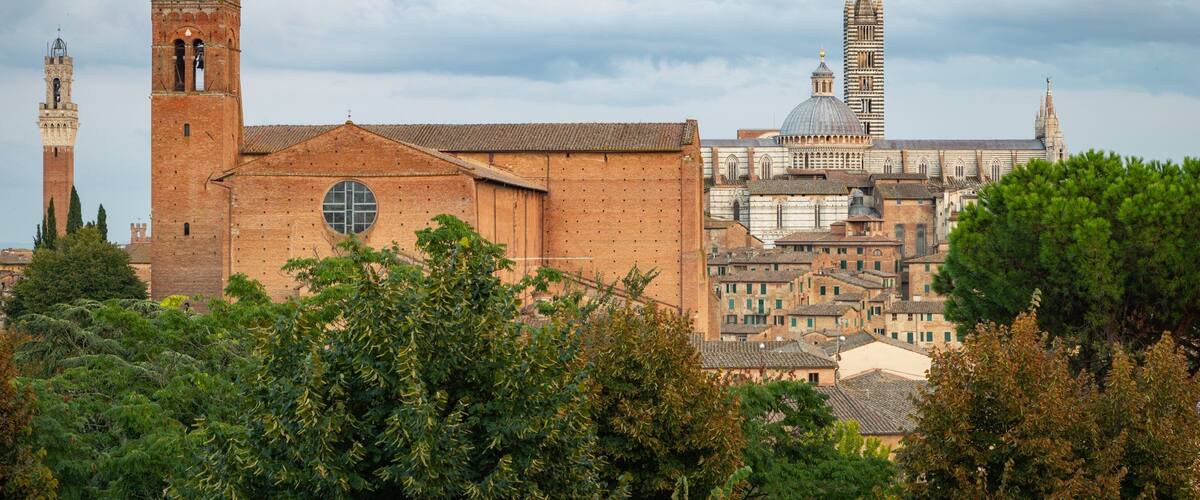 Basilica di San Domenico which includes heritage architecture, landscape views and a city