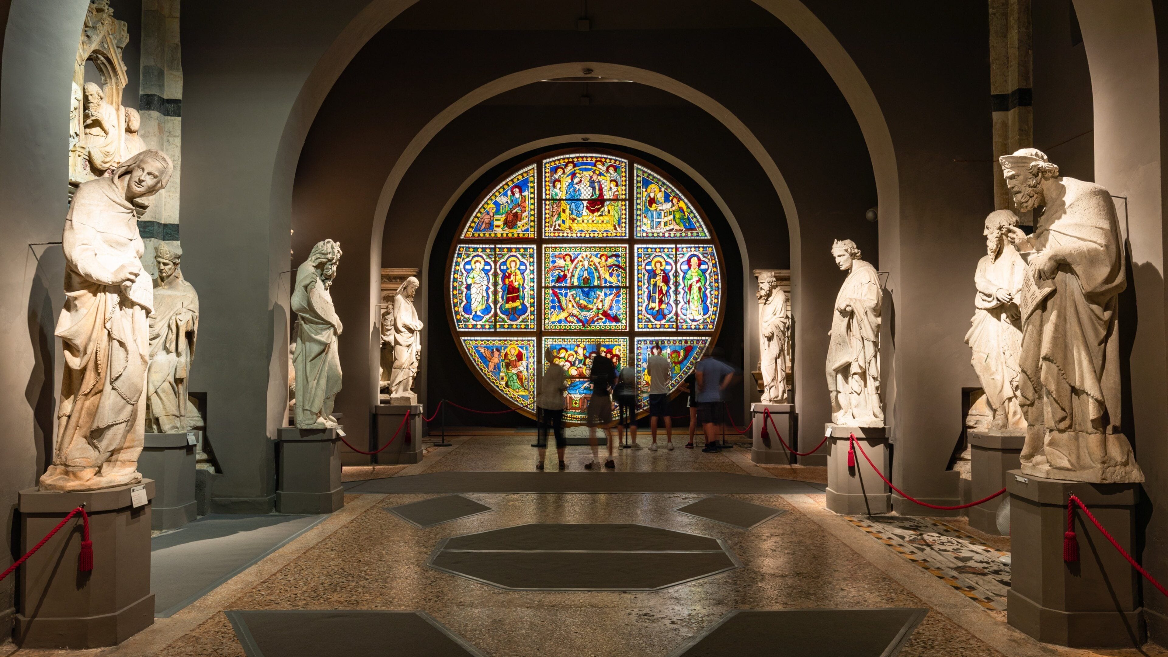 Museo dell\'Opera del Duomo showing interior views and a statue or sculpture as well as a small group of people