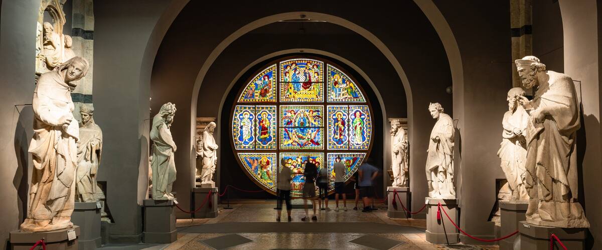 Museo dell\'Opera del Duomo showing interior views and a statue or sculpture as well as a small group of people