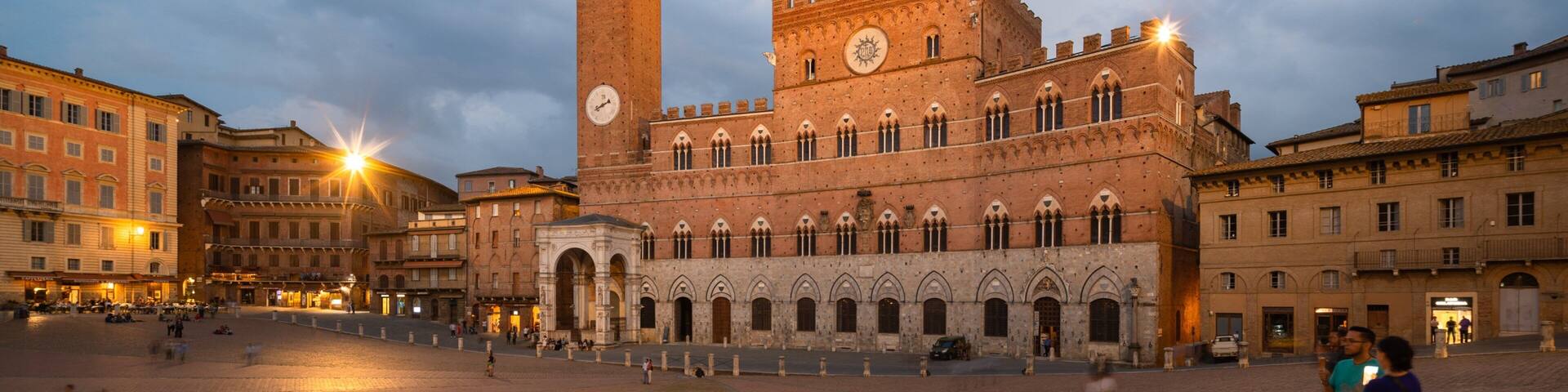 Palazzo Pubblico featuring a city, heritage architecture and night scenes